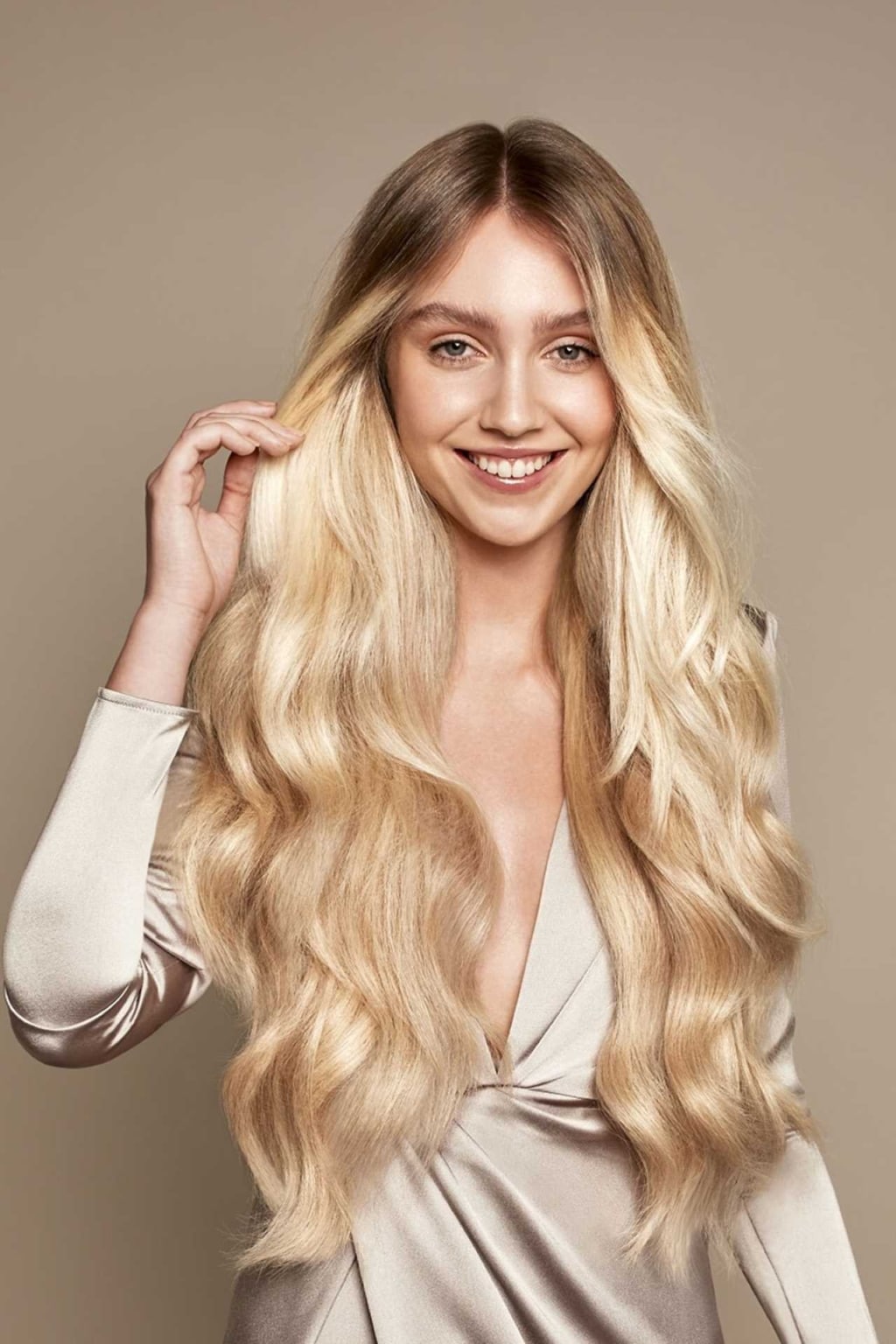 Woman with long hair in trendy balayage look