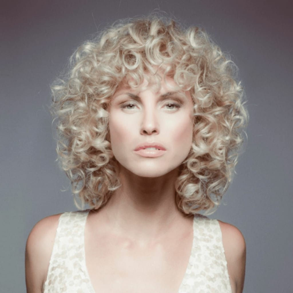 Woman with blonde curly hair